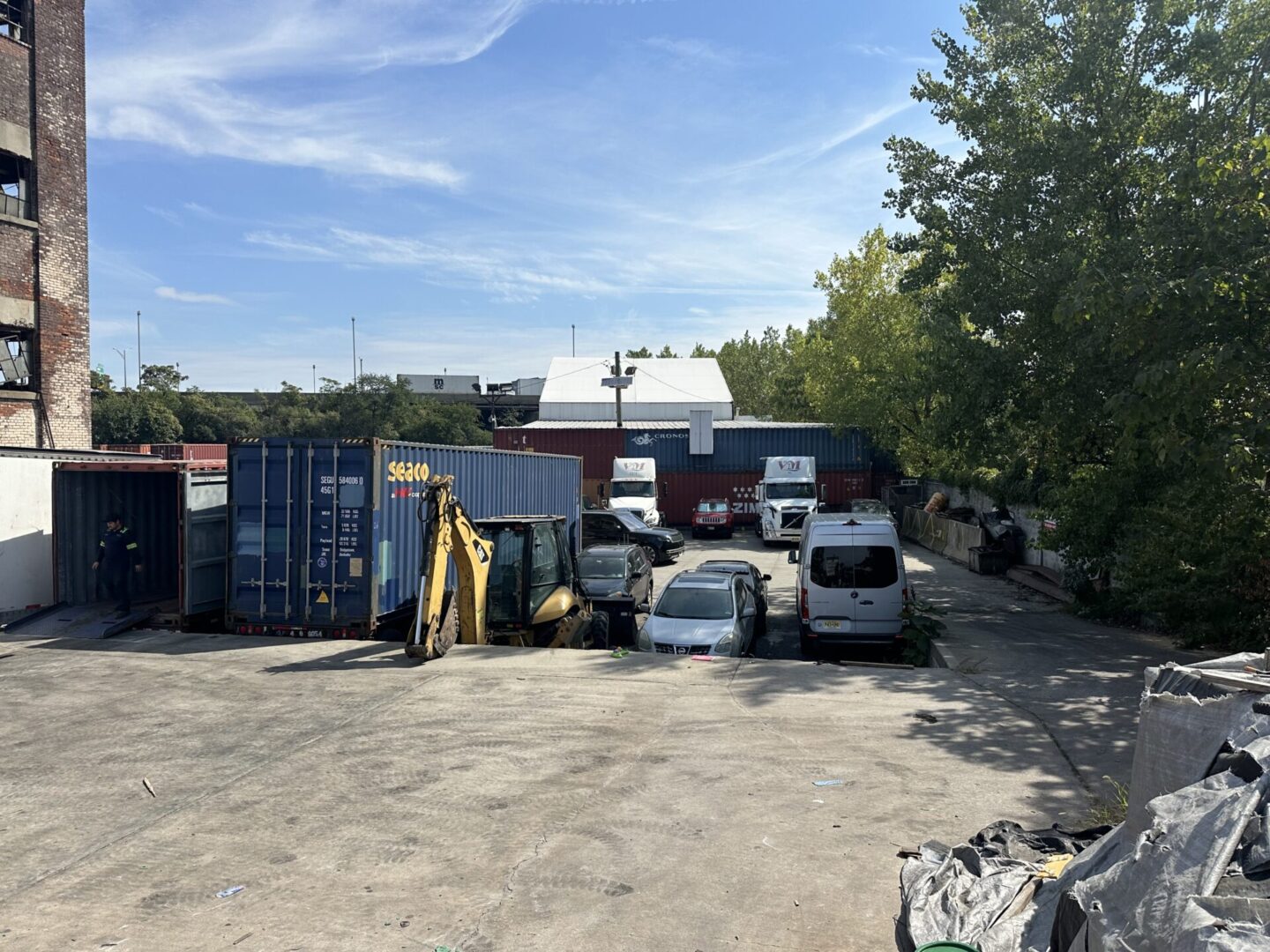 A parking lot with many cars parked in it